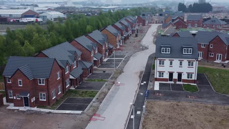 New-subdivision-incomplete-neighbourhood-housing-construction-site-grounds-aerial-view