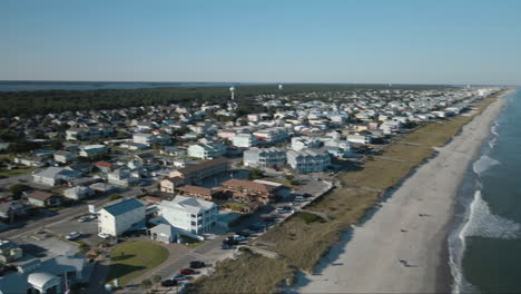 Establishing-aerial-view-panning-over-Kure-beach-property-and-seaside-view