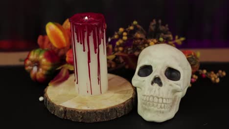 Skull-and-bloody-candle.-Autumn-decorations,-