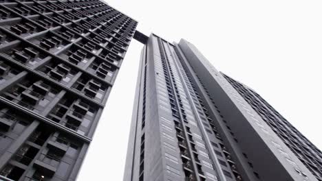 A-low-angle-view-in-a-public-place-looking-up-to-see-a-very-tall-condominium