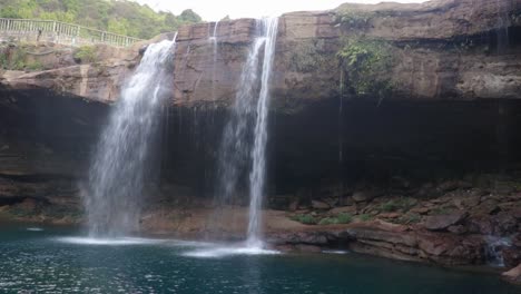pristine-natural-waterfall-falling-streams-from-mountain-top-at-morning-from-flat-angle-video-taken-at-krangsuri-fall-meghalaya-india
