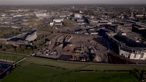 Aerial-approach-of-construction-site-at-riverbank-of-river-IJssel