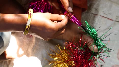 Woman-creating-typical-ornaments-with-help-of-hands-and-feet