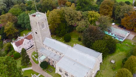 Aerial:-St-Michael's-Church-compound-in-Framlingham,-England---drone-tracking-shot
