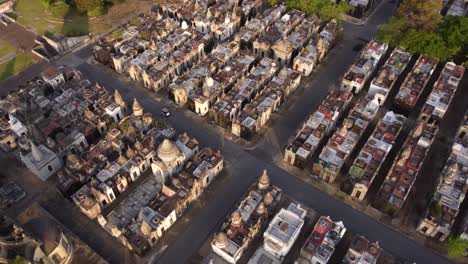 Hatchback-car-tour-at-Chacarita-cemetery-at-Buenos-Aires-aerial