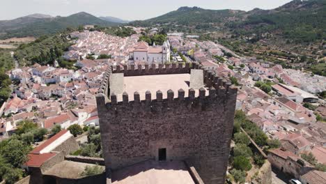 Aerial-around-Castelo-de-Vide-Castle-Tower,-Typical-Alentejo-village-as-Background
