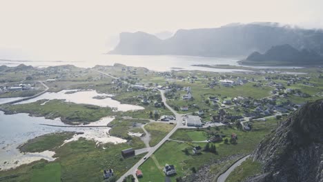 Small-living-town-on-Norwegian-coastline-with-majestic-mountain-landscape