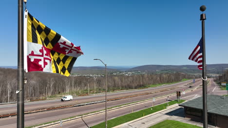 State-of-Maryland-MD-and-USA-flag-along-interstate-highway-road
