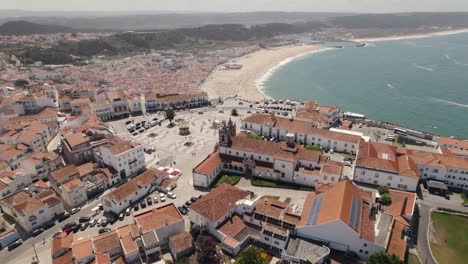 Sprawling-white-sand-beach-of-Nazare,-seaside-resort-town,-Portugal