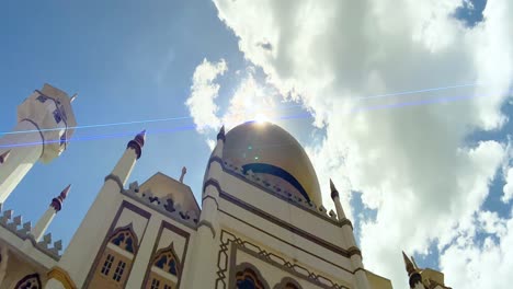 Facade-Of-Sultan-Mosque-Against-Bright-Sunny-Sky-In-Kampong-Glam,-Singapore-With-Sun-Flare-Effects