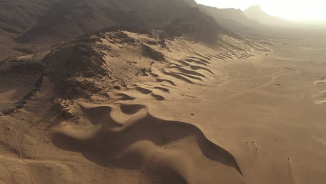 Sand-and-rocks-in-desert-landscape,-Zagora-in-Morocco