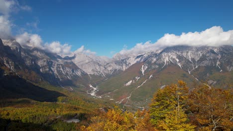 Mountains-covered-in-white-clouds-in-Autumn,-cinematic-revealing-of-breathtaking-Alpine-panorama