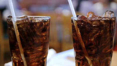 The-tingling-of-Coca-Cola-in-a-cold-glass-on-the-table-in-the-restaurant