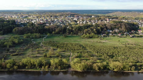 Beautiful-Lithuanian-town-on-top-of-river-slope-of-Nemunas,-aerial-pan-right-view