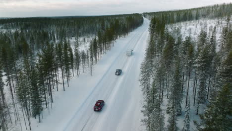 Camper-Van-Driving-Across-The-Winter-Road-In-Lapland,-Finland