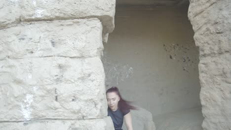 Woman-dancing-against-an-ancient-rock-pillar