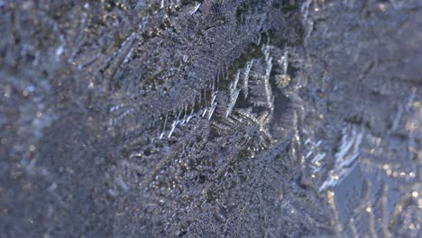 Frozen-Snowflakes-Formed-By-Cold-Weather-On-Glass-During-Winter