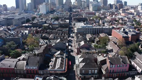 Aerial-descending-and-tilting-up-shot-of-Bourbon-Street-in-the-French-Quarter-of-New-Orleans-during-the-day