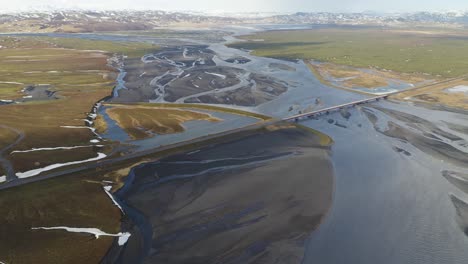 Aerial-view-of-famous-Eldvatn-River-and-bridge-in-scenic-landscape-of-Iceland-during-sunny-day