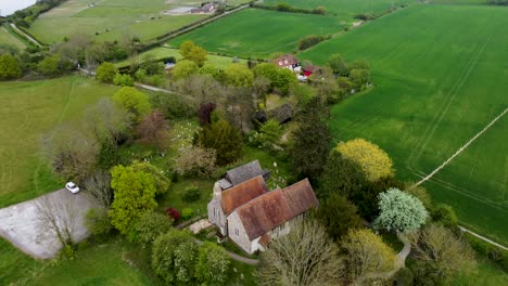 Flying-over-a-village-church-in-Blean-Kent,-UK