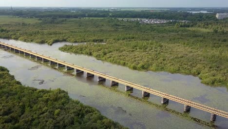 Aerial-drone-view-of-the-historic-Moerputten-railroad-bridge-in-the-Netherlands,-Europe