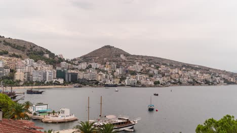 Fast-timelapse-over-beautiful-city-of-Saranda-with-ocean-and-boats-in-Albania