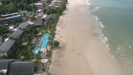 Aerial-view-of-touristic-beach-location-with-resorts-and-beach-in-Thailand