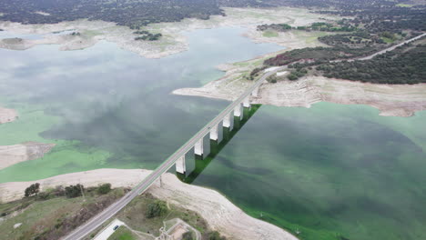 Aerial-view-of-road-bridge-across-the-green-river