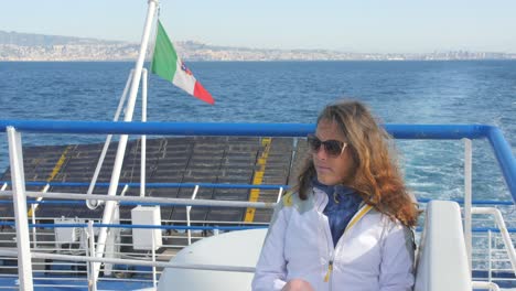 Woman-Sitting-On-The-Deck-Of-The-Ferry-Boat