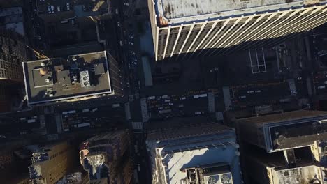 Aerial-view-above-streets-and-buildings-in-sunny-East-village,-Manhattan,-NYC,-USA---birds-eye,-drone-shot