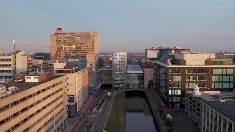 From-tea-pot-to-ink-pot-Hoog-Catharijne-central-train-station-in-Utrecht-at-sunrise-revealing-financial-and-shopping-district-with-modern-office-buildings