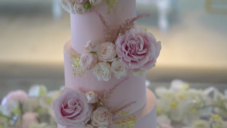 A-delicious-pink-frosted-cake-decorated-with-pink-rose-flowers