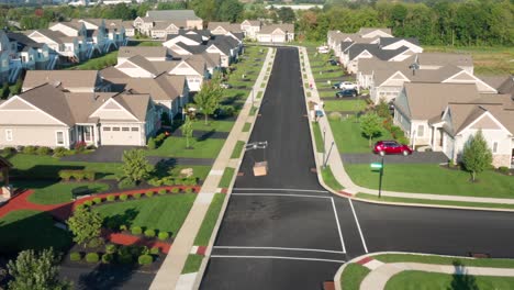 Aerial-of-drone-package-delivery-in-USA-neighborhood