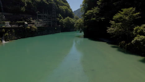 Aerial-Tracking-Backward-Over-Small-Dam-In-Kochi-Prefecture-On-The-Island-Of-Shikoku,-Japan