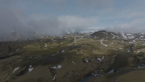Rollings-Hills,-Mountains,-and-Rivers-in-Beautiful-South-Iceland-Landscape---Aerial-view-with-Copy-Space-in-Sky