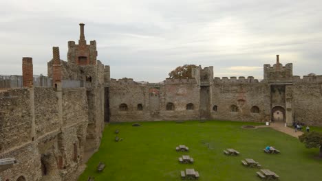 Panoramic-inside-view-of-Framlingham-Castle-with-green-field-at-Suffolk,-England---panning-shot