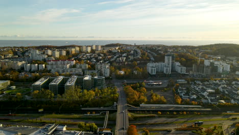 Aerial-Distant-View-of-Pomeranian-Science-and-Technology-Park-Gdynia-buildings-at-sunrise-with-cityscape-on-Baltic-sea-background