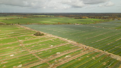 Aerial-View-Of-The-Ongoing-Construction-Of-Solar-Farm-In-Zwartowo,-Northern-Poland