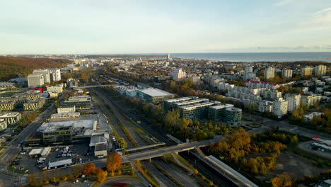 Autumn-Gdynia-city-skyline-with-Pomeranian-Science-and-Technology-Park-Gdynia-buildings-at-sunrise,-Baltic-sea-background
