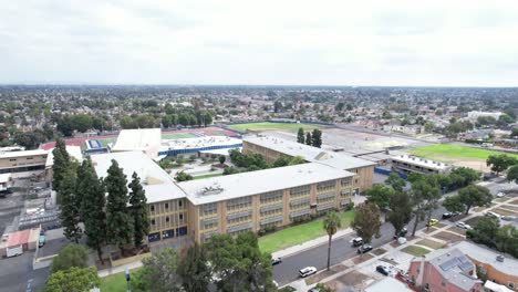 Crenshaw-high-school-public-secondary-school-aerial-rising-view-above-building