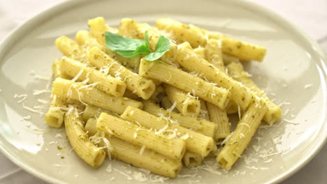 pesto-rigatoni-pasta-with-parmesan-cheese---Italian-food-and-vegetarian-food-style