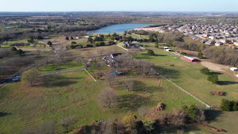 Aerial-footage-of-Melissa-Texas-flying-towards-a-large-pond