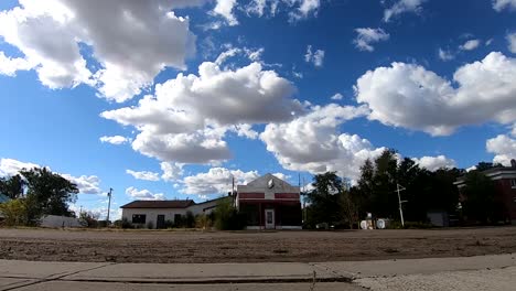 TIMELAPSE---Clouds-moving-over-a-small-old-abandoned-store-in-a-small-town-near-Alberta-Canada
