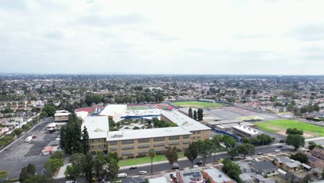 Wide-Orbiting-Aerial-View-of-Crenshaw-High-School-Campus,-South-Los-Angeles-District,-California