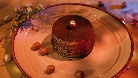 Plate-Of-Chocolate-Crepe-Cake-With-Pistachio-On-The-Party-Table