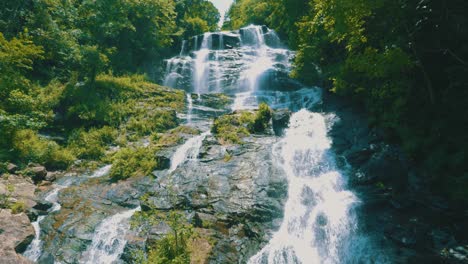 Epic-close-up-footage-of-Amicalola-Falls,-the-largest-waterfall-in-all-of-Georgia,-towering-over-the-area-at-729-feet-tall
