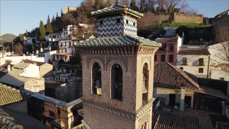 Stunning-design-of-bell-tower-of-Mudejar-church,-Granada,-Spain