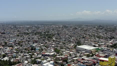 Santo-Domingo-suburb,-Dominican-Republic.-Aerial-forward