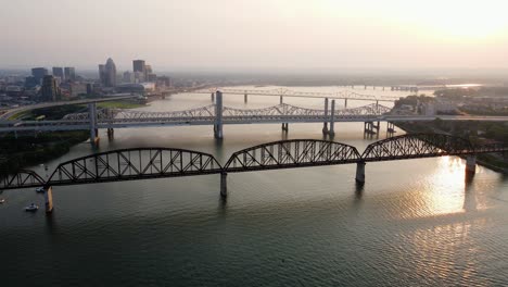Aerial-drone-view-of-bridges-between-Louisville-and-Jeffersonville,-sunset-in-USA