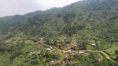 Villages-along-dirt-road-in-steep-Rift-Valley-jungle-mountains,-Congo